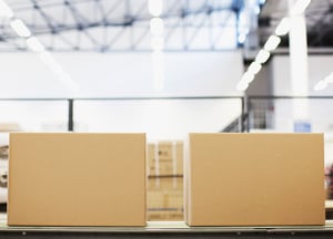 Two boxes side by side inside a fulfillment center