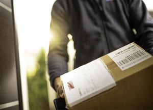 Box being delivered to a customer's front door